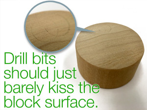 Set paper drill bit depth to just kiss the block