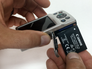 proper canon passport camera battery insertion